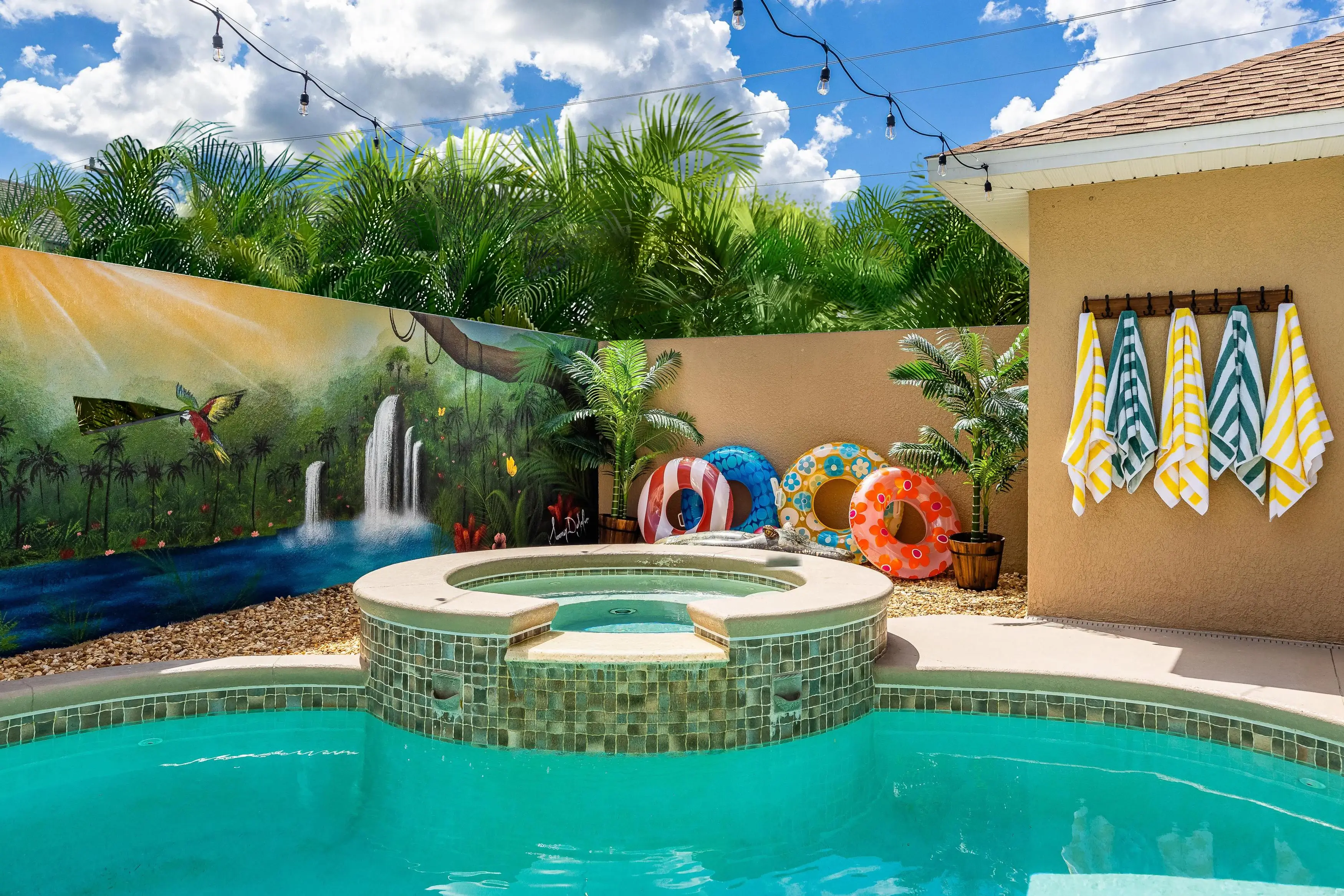 Enjoy a refreshing dip in the heated pool, surrounded by lush greenery and tranquil canal views.